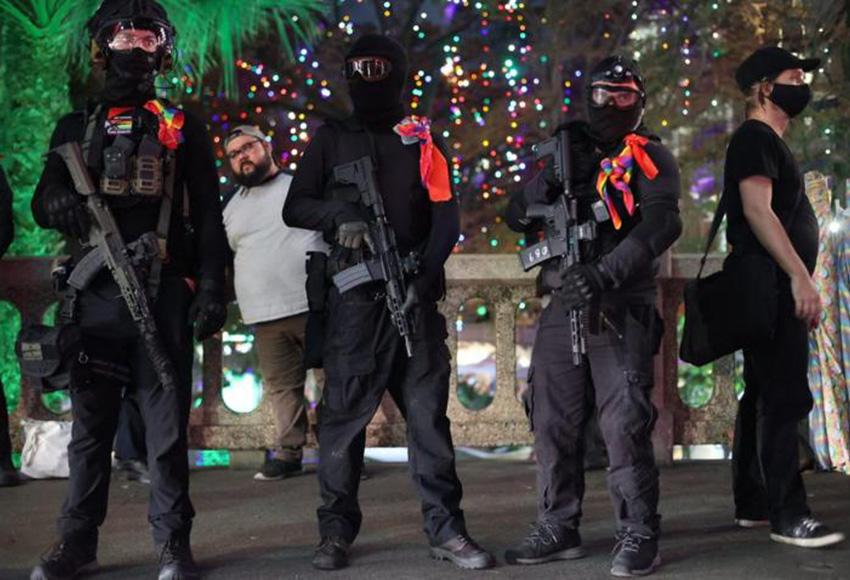 Armed counterprotesters said they came out to defend the rights and safety of the LGBTQ community Tuesday night — Photo by Bria Woods / San Antonio Report