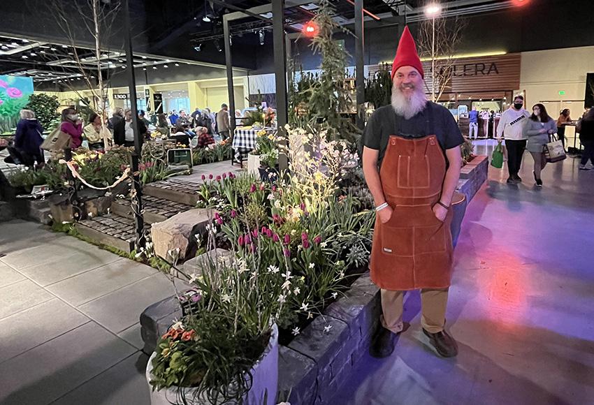 An attendee dressed as a garden gnome on the show floor — Photo by Daniel Lindsley