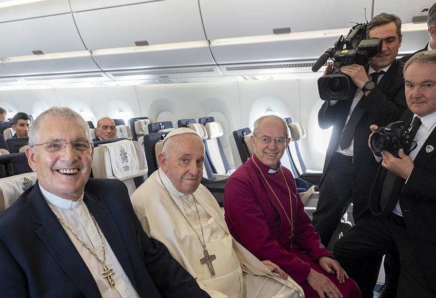 Rev. Iain Greenshields, moderator of the Presbyterian Church of Scotland, Pope Francis and Anglican Archbishop Justin Welby sit together aboard the flight from Juba, South Sudan, to Rome Feb. 5, 2023 — Photo courtesy Andrew O'Brien / Church of Scotland