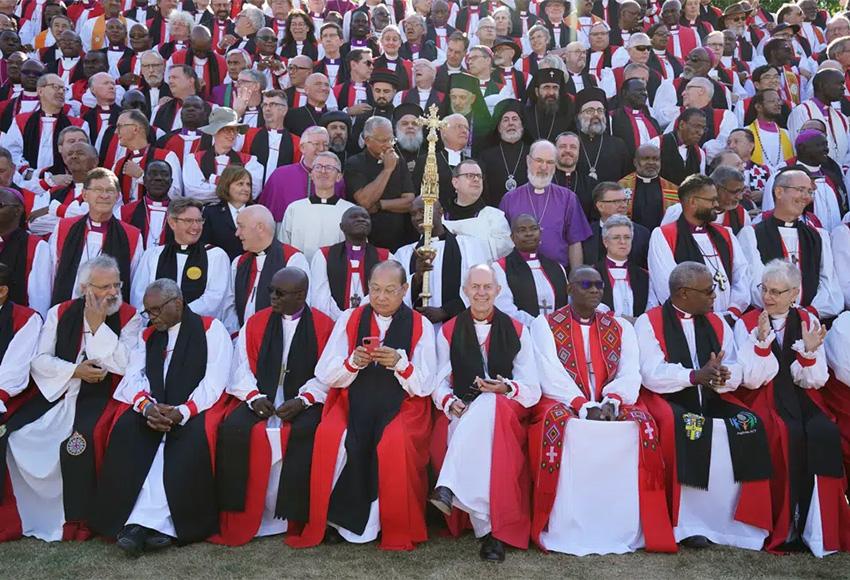 Archbishop of Canterbury Justin Welby, front row, center right poses for a photo with bishops from around the world at the University of Kent  — Photo by Gareth Fuller / PA via AP