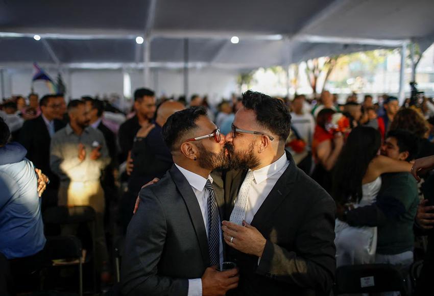 A couple kisses at a celebration in Mexico City  — Photo by Raquel Cunha / Reuters