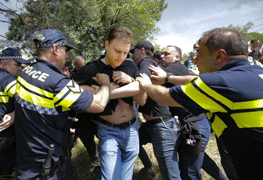 Police detain an opponent of Gay Rights in Tbilisi, Georgia — Photo by Zurab Tsertsvadze / AP