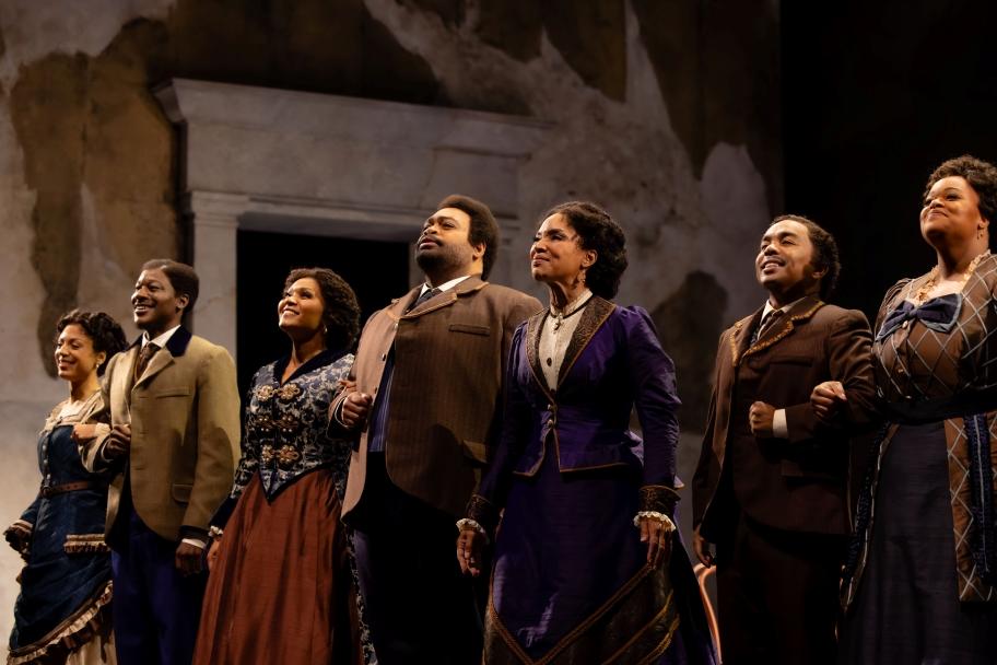 From left to right: Sarah Joyce Cooper (Minnie Tate), Greg Watkins (Benjamin Holmes), Aundi Marie Moore (Maggie Porter), Darren Drone (Edmund Watkins), Lisa Arrindell (Ella Sheppard), Martin Bakari (Greene Evans), and Tiffany Townsend (America Robinson) in "Jubilee" at Seattle Opera. Photo: Sunny Martini.